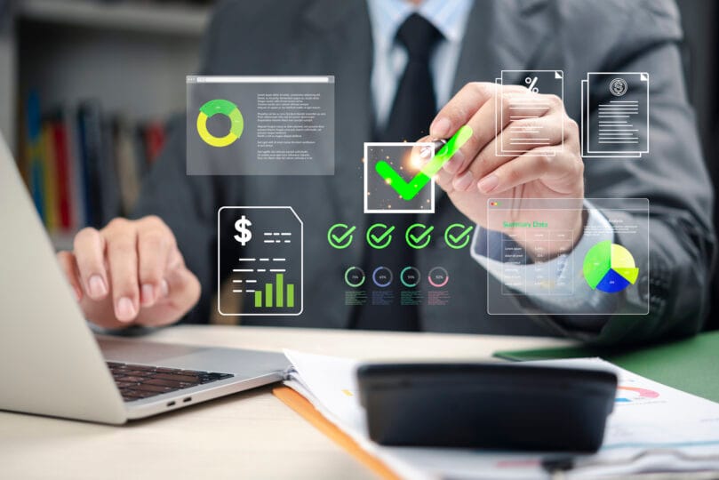Businessman analyzing financial data with digital checklist and charts, representing finance management, business strategy, investment planning, accounting, and corporate success.